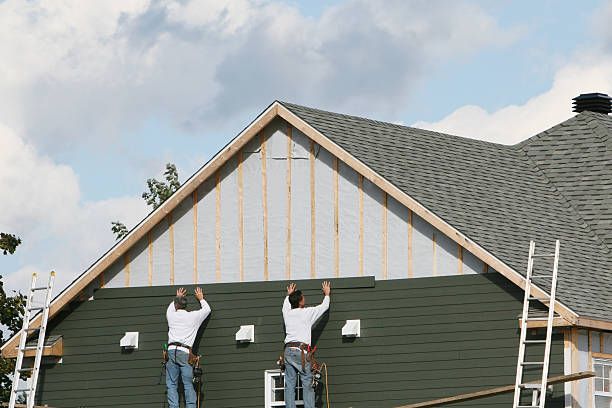 Professional Storm Damage Siding Repair technician working in Leesburg, FL